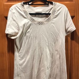 Short sleeved tan/beige shirt.